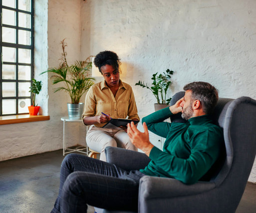 a man sharing his problems to his psychiatrist