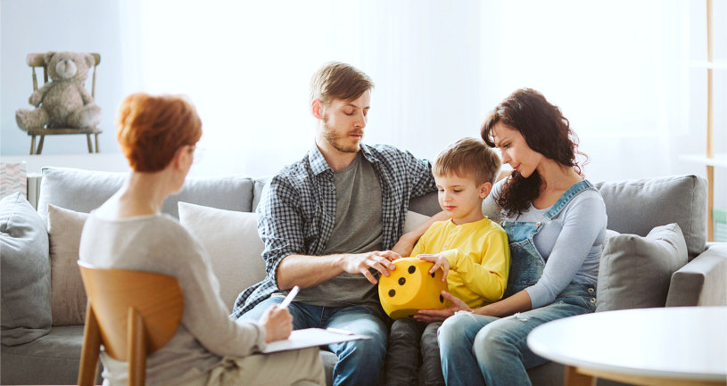 a married couple with their son went to their psychiatrist to talk about their child's bad behavior
