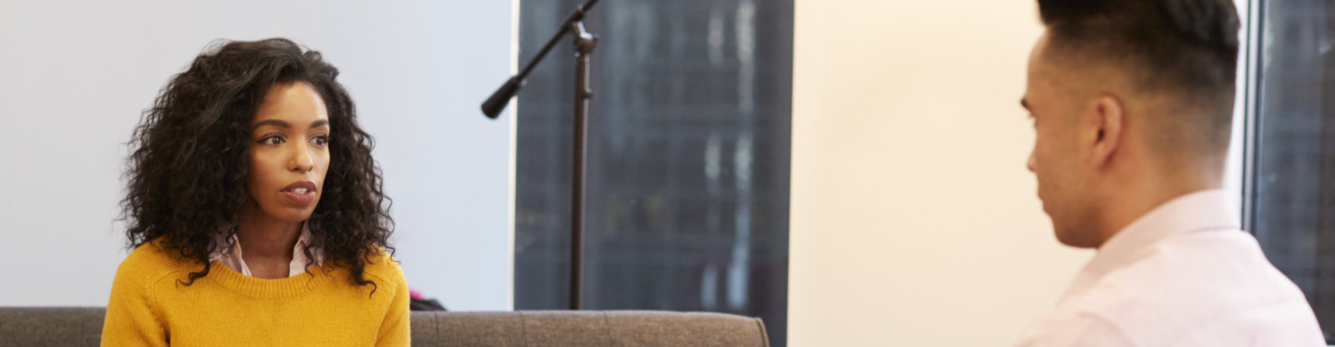 curly-haired woman with her psychiatrist