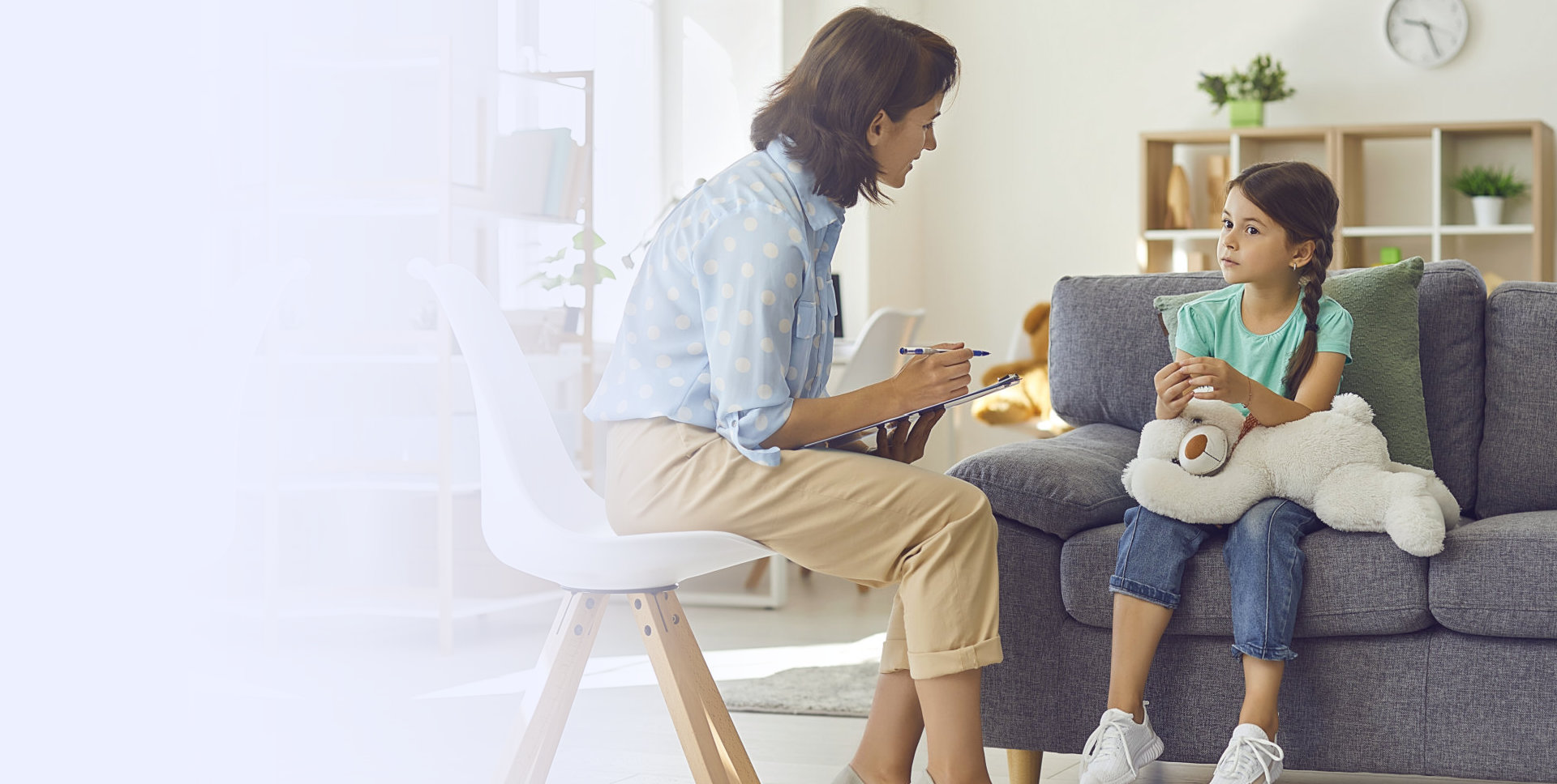 a young kid talks about her problem to her psychiatrist while her psychiatrist is taking down notes