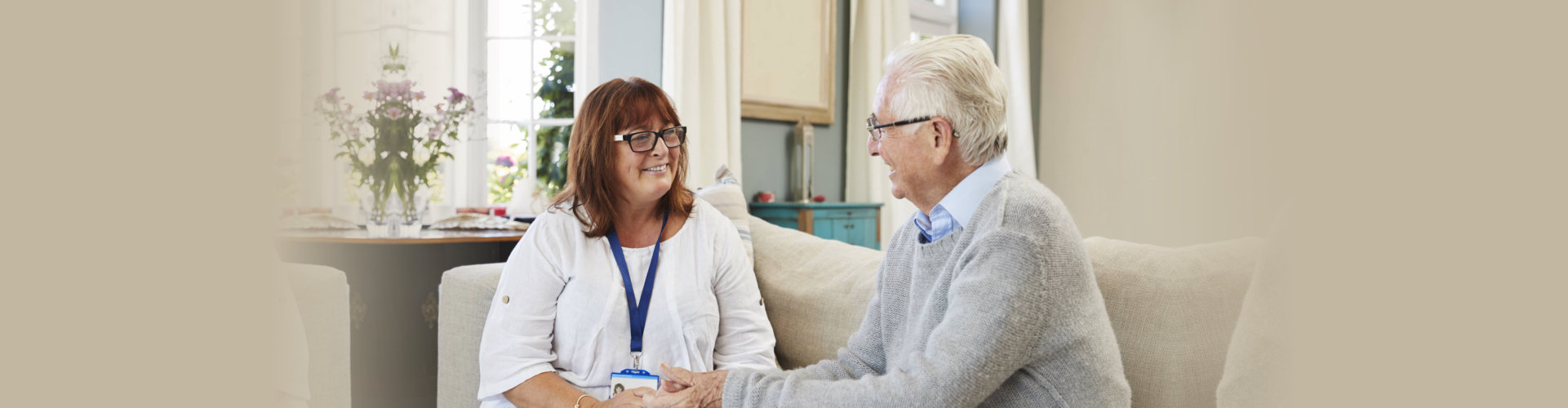 a senior man smiling with his therapist